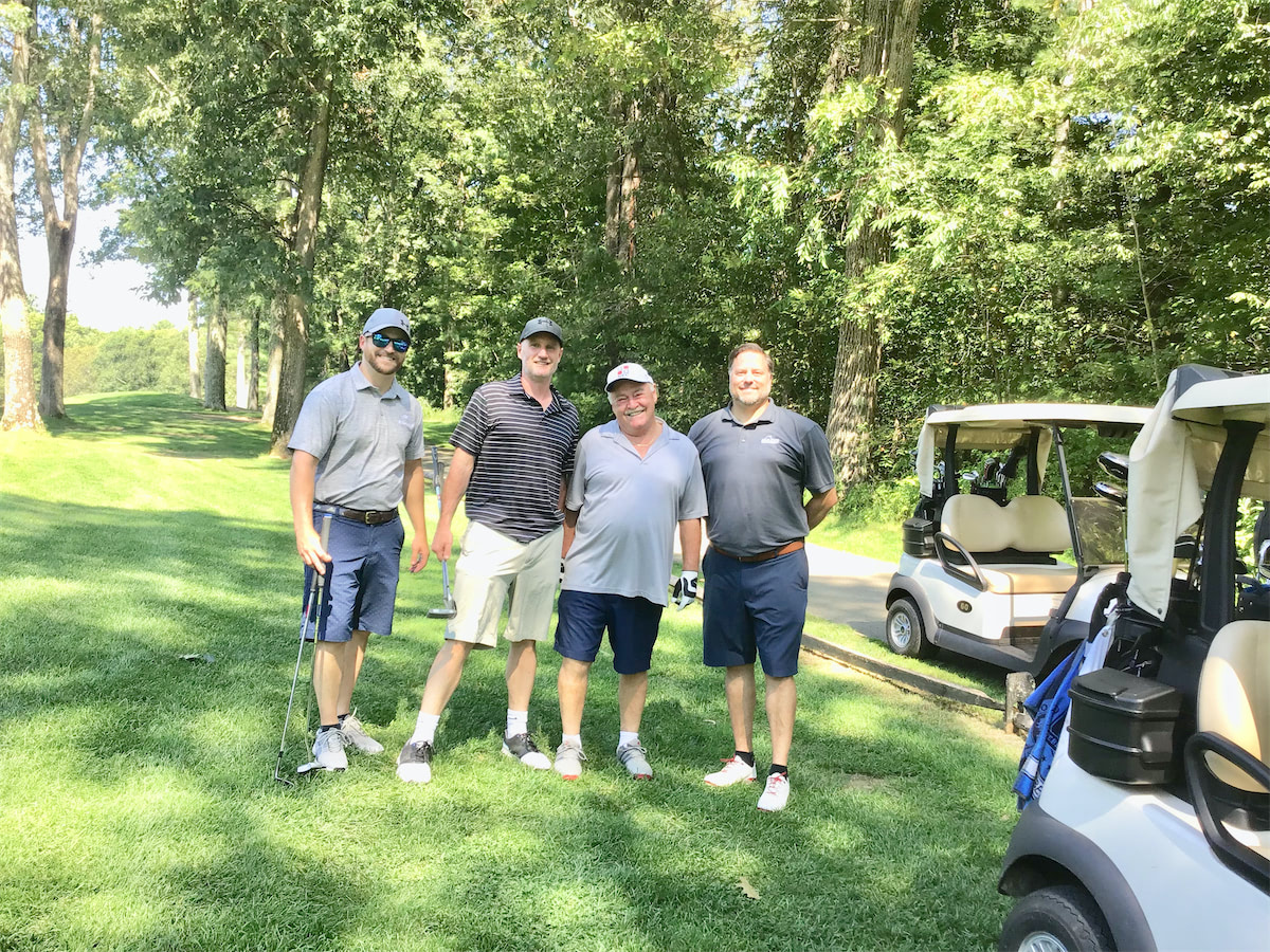 Solid State Community Golf Classic team on the green