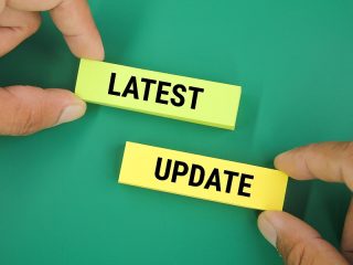 Blocks Reading “Latest Update” On Green Background